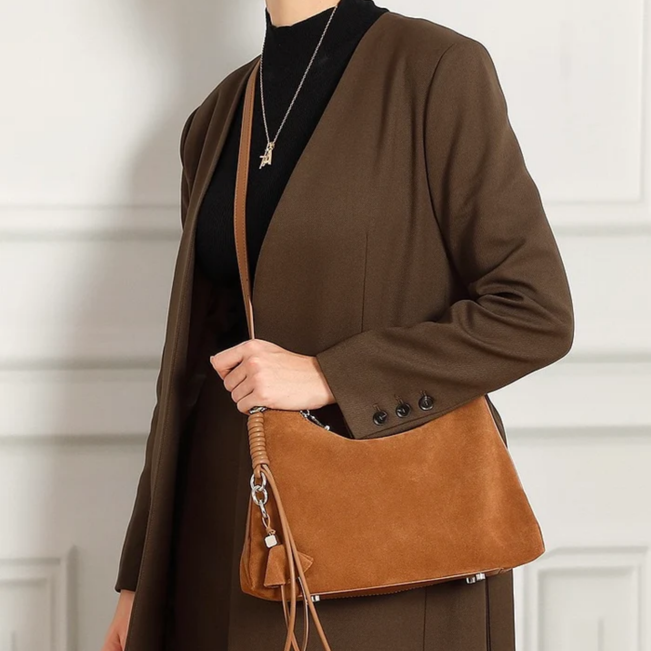 Genuine Leather Hobo Bag with Braided Detail and Tassel Accent for Everyday Use