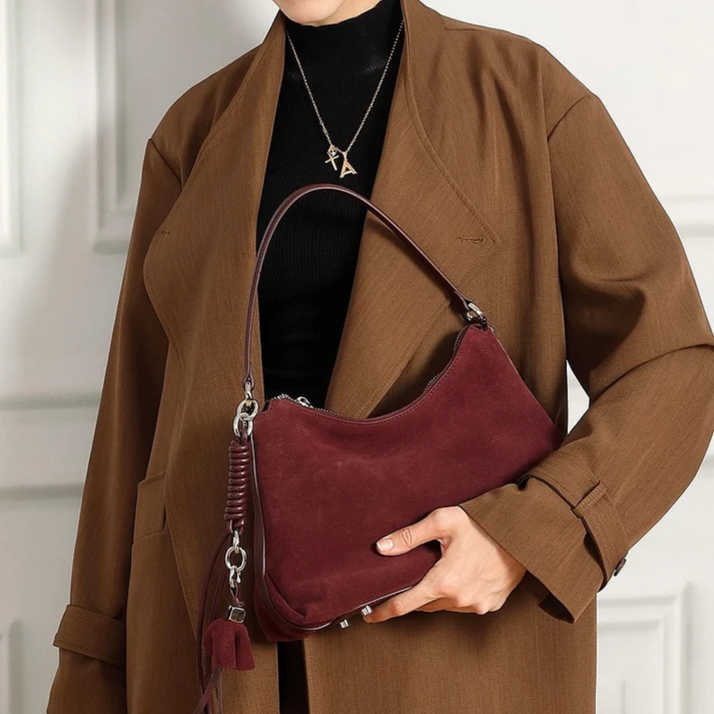 Genuine Leather Hobo Bag with Braided Detail and Tassel Accent for Everyday Use